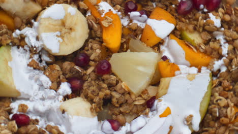 Fruits-cereals-poured-milk-close-up.-Granola-preparing-with-natural-yogurt.