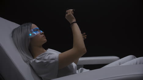 Closeup-girl-play-augmented-reality-in-sensor-gloves.-Gamer-enjoy-simulation
