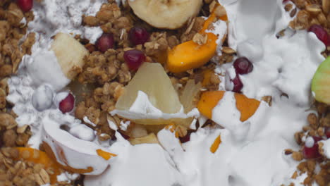 Yogurt-pouring-granola-fruits-super-slow-motion-closeup.-Cereal-flakes-with-milk