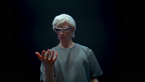 Virtual-reality-man-glasses-experience-simulation-closeup.-Futuristic-blonde-guy