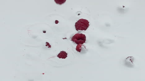 Raspberry-falling-dairy-dessert-in-super-slow-motion-close-up.-Natural-cocktail.