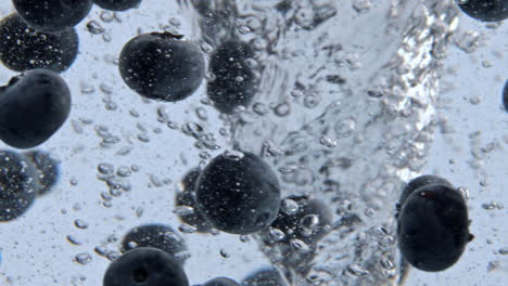 Mineral-water-blueberries-tornado-closeup.-Organic-berries-spinning-cold-water