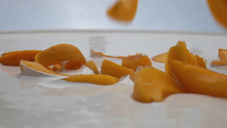 Apricot-dropped-dairy-dessert-in-super-slow-motion-close-up.-Healthy-breakfast.