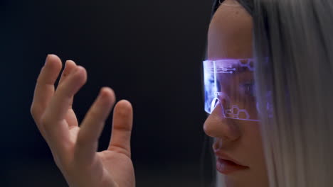 Thoughtful-user-examining-VR-technologies-closeup.-Woman-exploring-metaverse