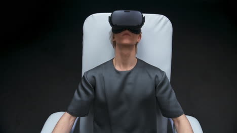 Full-equipment-guy-enjoying-virtual-reality.-Smart-player-trying-new-videogame