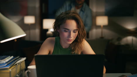 Thoughtful-freelancer-noticing-table-remotely-closeup.-Girl-watching-laptop
