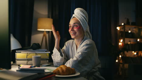 Happy-girl-waving-hand-closeup.-Cheerful-woman-making-night-video-call-at-home