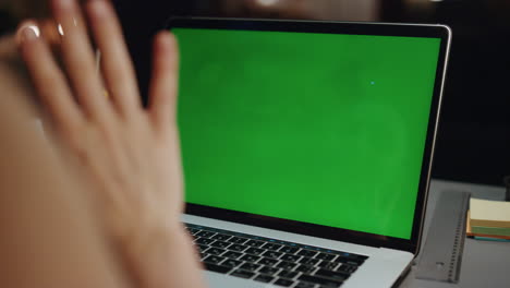 Woman-hand-waving-mockup-laptop-at-home-closeup.-Unknown-girl-having-video-call