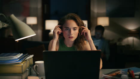 Nervous-woman-annoyed-computer-at-night-flat-closeup.-Girl-trying-concentrate