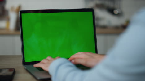 Hands-typing-mockup-computer-close-up.-Businessman-using-green-screen-laptop.
