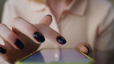 Woman-using-smartphone-closeup.-Girl-holding-mobile-phone-surfing-in-internet.