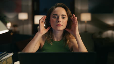 Pensive-woman-watching-screen-at-dark-apartments-closeup.-Girl-tie-hair-pencil