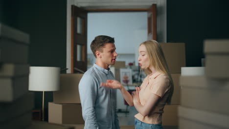 Boyfriend-shouting-stressed-girlfriend-emotionally-in-new-house-close-up.