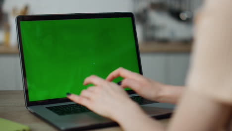 Girl-working-mockup-computer-at-home-close-up.-Hands-typing-on-laptop-keyboard.