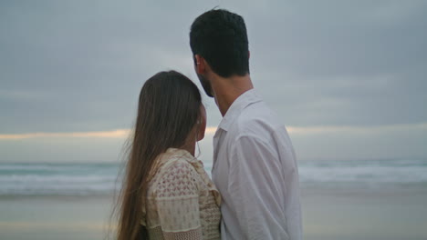 Love-couple-touching-hands-in-marine-view.-Romantic-people-at-ocean-vertically