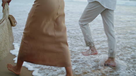 Sweethearts-feet-running-sand-beach-at-sea-vacation.-Couple-walking-on-shore