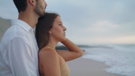 Sensual-sweethearts-enjoy-sea-stormy-beach-closeup.-Sexy-woman-looking-camera