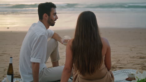 Romantic-lovers-relaxing-ocean-beach.-Latin-man-speaking-woman-vertical-video