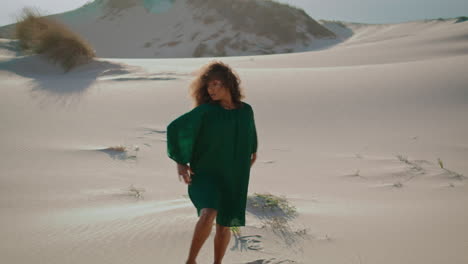 Girl-dancer-moving-dunes-summer-day.-Woman-dancing-freestyle-on-sand-desert.