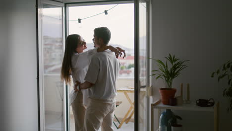 Love-couple-hugging-hotel-vertical-closeup.-Romantic-people-moving-in-dance