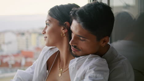 Affectionate-people-embracing-terrace-closeup.-Latina-lovers-enjoying-marriage