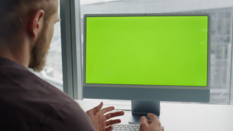 Man-videocalling-chromakey-computer-at-office.-Unknown-specialist-video-call