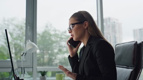 Office-manager-complaining-phone-closeup.-Upset-woman-executive-talk-cellphone