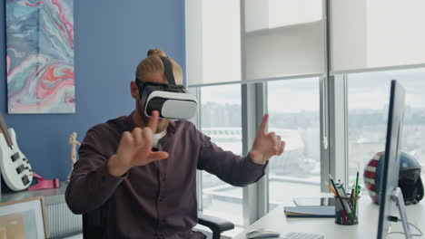 Involved-startuper-swiping-metaverse-home-office.-Man-exploring-virtual-reality