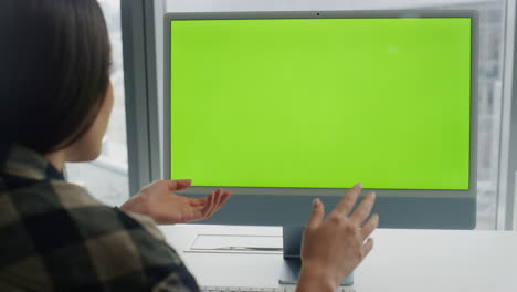 Startuper-videocalling-greenscreen-computer-office.-Woman-explaining-video-call