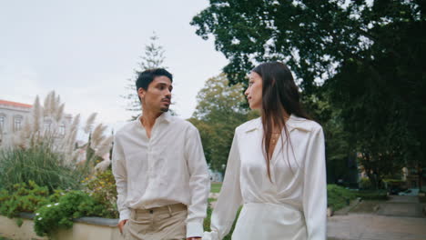 Romantic-couple-walking-stairs-outdoors.-Hispanic-pair-enjoying-date-at-nature