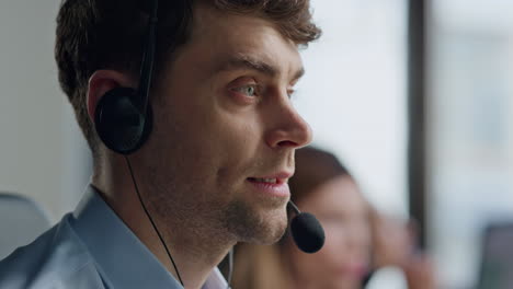 Portrait-call-center-specialist-talking-microphone.-Focused-man-helping-client