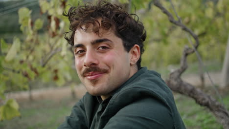 Vertical-portrait-man-vineyard-looking-camera-with-smile.-Italian-guy-posing