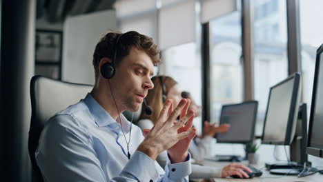 Operator-listening-customer-online-in-office.-Focused-man-agent-think-solution
