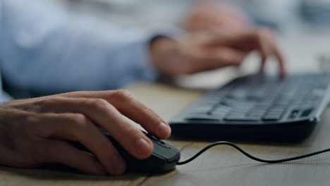 Operator-hands-typing-keyboard-closeup.-Office-manager-working-clicking-mouse
