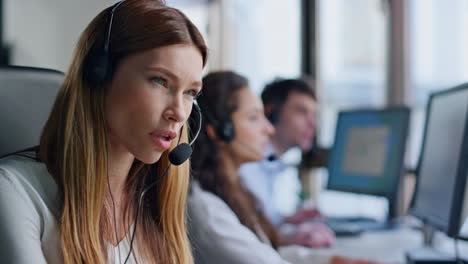 Tired-operator-talk-headset-in-call-center-closeup.-Service-agent-consult-client