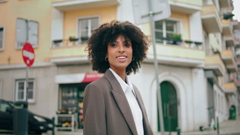 Girl-looking-around-standing-at-city-street-closeup.-Happy-woman-exploring-town