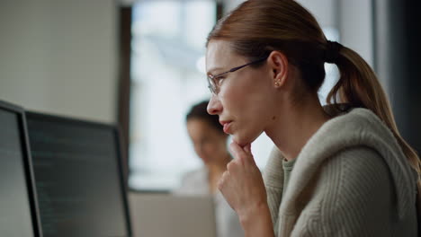 Woman-developer-checking-code-closeup.-Focused-software-engineer-work-computer