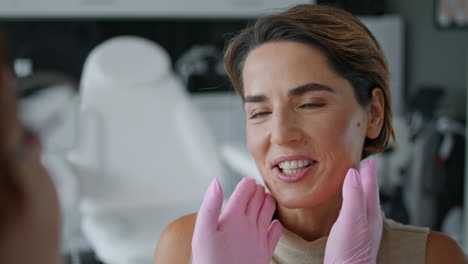 Woman-taking-beautician-consultation-in-clinic-close-up.-Examining-facial-skin.