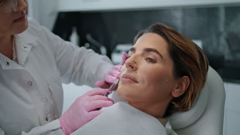 Woman-making-beauty-injection-in-cosmetology-clinic-close-up.-Skin-rejuvenation.