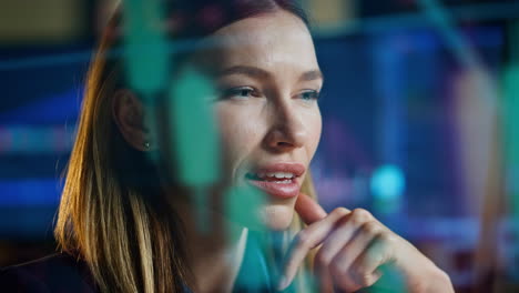 Closeup-successful-trader-looking-profit-strategy.-Smiling-woman-in-hologram