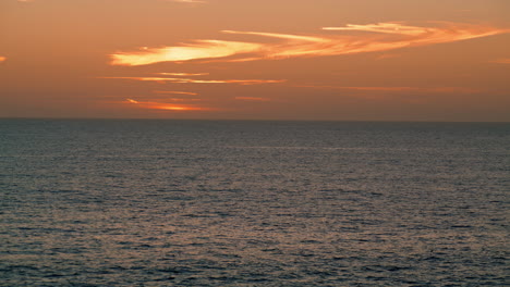 Calm-ocean-sunrise-horizon-view-in-summer.-Beautiful-golden-sunset-landscape.