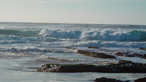 Foaming-ocean-water-rolling-towards-rocky-coastline.-Extreme-nature-energy.