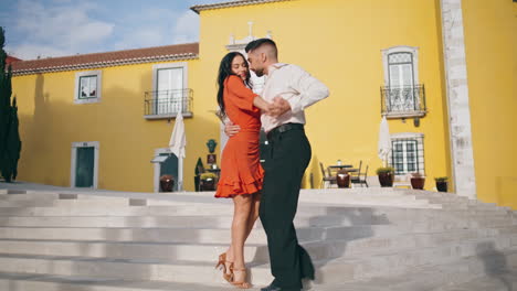 Latin-dance-performers-moving-passionately-on-city-stairs.-Couple-performing