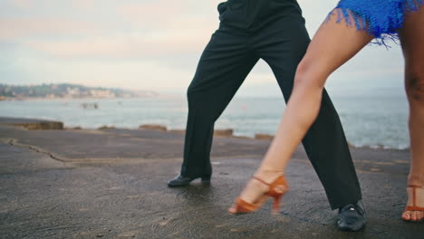Dancers-legs-moving-professionally-on-gloomy-waterfront-closeup.-Energetic-dance