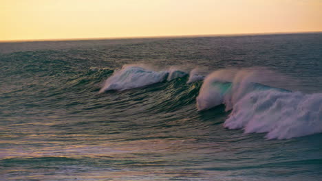 Stormy-ocean-water-rolling-in-super-slow-motion.-Foamy-waves-breaking-surface