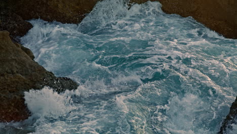 Stormy-ocean-breaking-rocks-outside-closeup.-Foamy-sea-waves-crashing-by-stones
