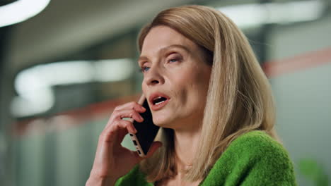 Serious-businesswoman-talking-cellphone-indoors-portrait.-Close-up-ceo-calling
