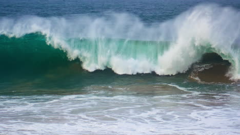 Huge-ocean-surf-barrelling-in-super-slow-motion.-Powerful-wave-rolling-breaking