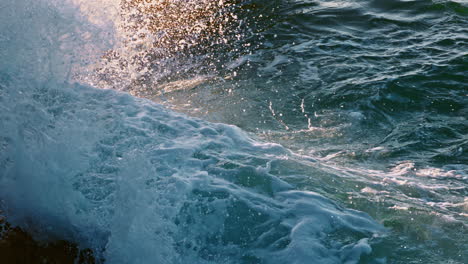 Foamy-wave-breaking-coast-outside-closeup.-Wild-water-crushing-dangerous-rocks