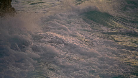 Churning-ocean-washing-cliff-at-morning-environment-closeup.-Waves-crashing
